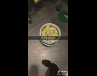 Guy opens bucket full of pickles 