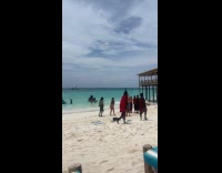 Woman teaches locals dance for beach video
