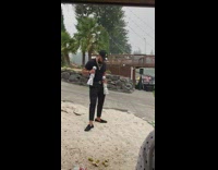 Man black top hold white statue pictorial