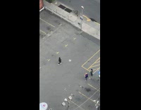 Guy black hoodie jacket dance parking lot