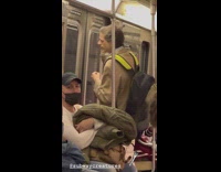 Guy combs his hair on subway with a fork