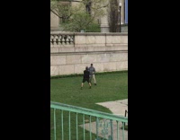 Two Pairs of People Sword Fight at University 