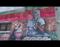 Woman hold cup mural steam from pipe