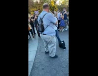 Blue shirt guy sprays champagne park shoey 