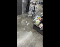 Water overflow from manhole inside grocery store