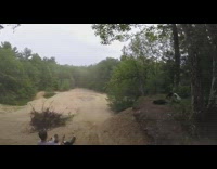 Guy riding dirt bike jumps and crashes 