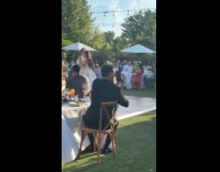 Bird randomly lands on man shoulder at wedding