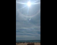 Collab WINY - Rainbow ring halo around sun over beach