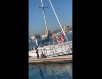 Three people dances on boat for video
