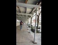 Black beanie guy runs down sidewalk yells