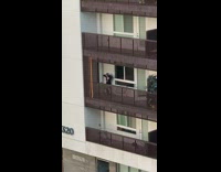 girl balcony open shirt sexy pose