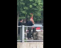 Woman red boots pole dancing at public