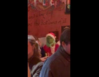 The Grinch enjoys at bar with friends