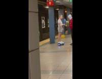 Girl lip sings to person at subway 