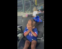Little girl hugs cotton candy before eating it 