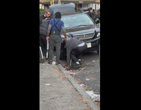 Man gets his phone from the canal at street in NY 