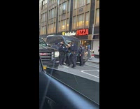 Group of cops detain one guy 