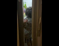 Toddler boy with body inside open fridge
