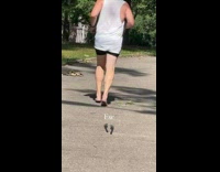 Man tank top run barefoot on street