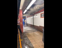 Rain water pouring down hard from subway ceiling
