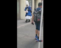 Person wearing tall white wig old english outfit