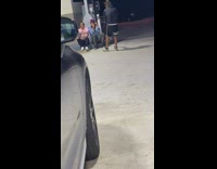 Two men with hoodie raps at the gasoline station