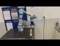 Robot arm stacks wood blocks unplugs cord 