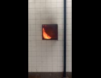 Fire from square hole on wall underpass
