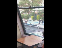 Girl sits on roof blue white truck 