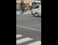 Girl black fishnet crosswalk car honks 