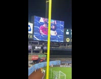 Two men asleep at baseball stadium