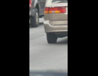 Van on freeway with bouncing tire 
