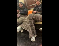Two women with same leopard print pants