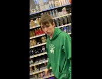 Guy tosses liter of soda in grocery store aisle makes a mess