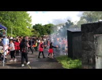 Filmer show crowd on street during Halloween