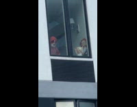 Creepy dolls on the window of building