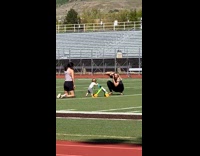 Baby uses walker to walk track field 