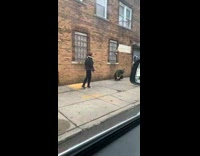 Man black winter jacket walk pose sidewalk