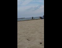 Woman white polo dance tiktok video shoot beach