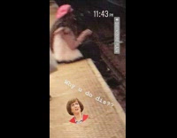 Girl fur jacket pink hat beret sitting hanging legs off subway tracks platform