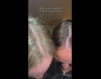 Two friends record themselves eating chocolate mousse with no hands