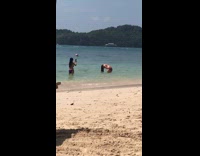 woman dips hair in water flips