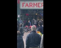 Green sweater blue sports car pike place