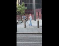 Woman white crop top blue bottoms raise hands 