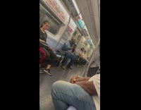 Guy sings with speaker on train 