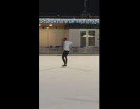 Guy on phone falls while ice skating