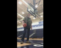 Guy shoots basketball from bleachers 