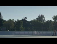 Guy on rollerblades hits hockey puck net 