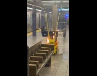 Mop bucket and trash burns at subway station 