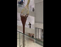 Man setup camera on the stair railings then pose
